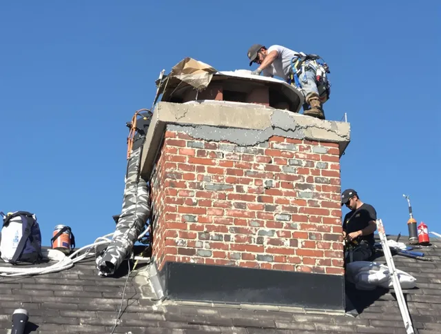 Covina Chimney Sweep installing a custom chimney crown in Covina, CA