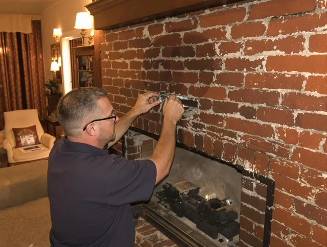 Covina Chimney Sweep expert fixing a fireplace in Covina, CA